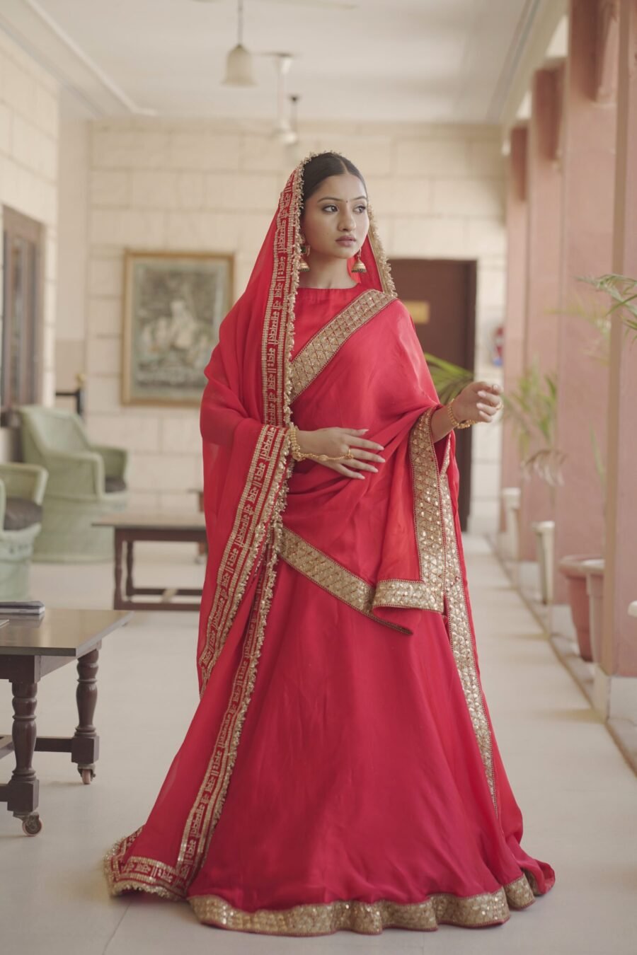 Red bridal lehenga set with shawl and veil