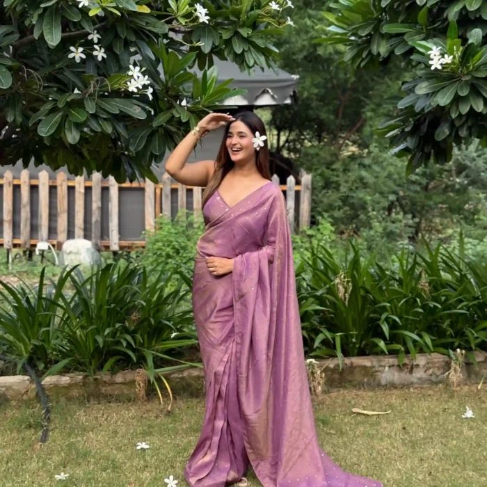 Mauve tissue saree featuring mukesh embroidered buttis on saree