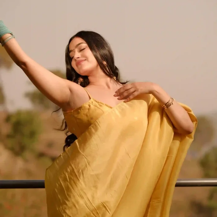 Plain yellow tissue saree featuring mukesh embroidered blouse